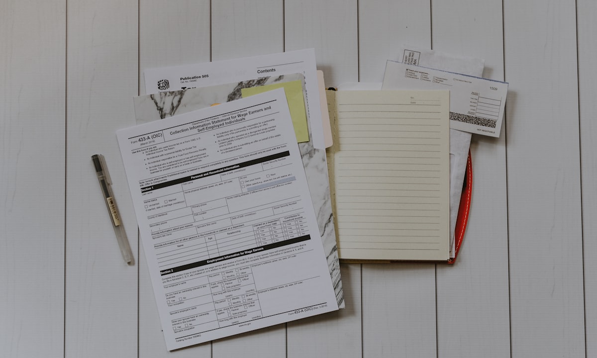 A person holding a settlement check — Lemonaid Firm's default outcome is a cash settlement for diminished value, with the client keeping the vehicle